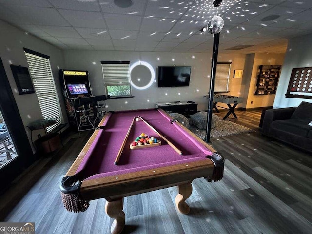 game room featuring billiards, a paneled ceiling, and hardwood / wood-style flooring