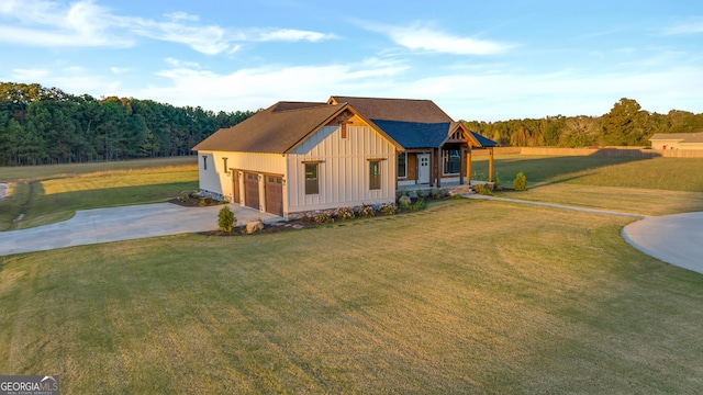 view of front of house with a garage and a front lawn