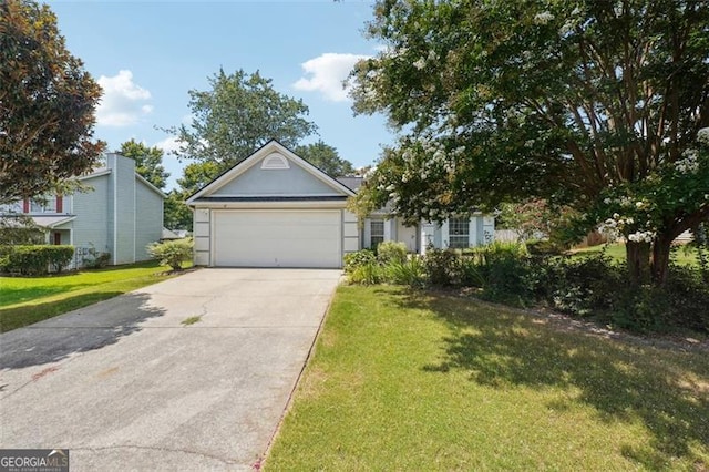 view of front of property with a garage and a front yard