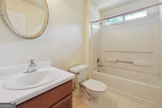 full bathroom featuring toilet, vanity, and bathing tub / shower combination