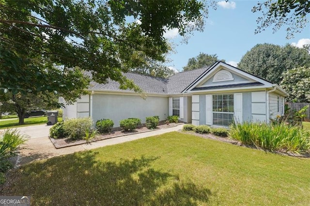 ranch-style home with a front yard