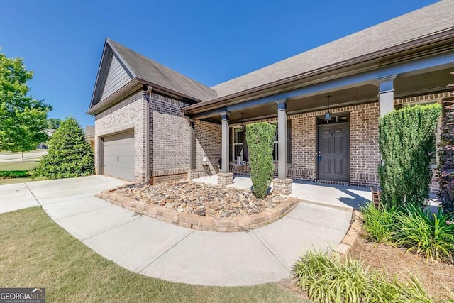 view of front of home with a garage and covered porch