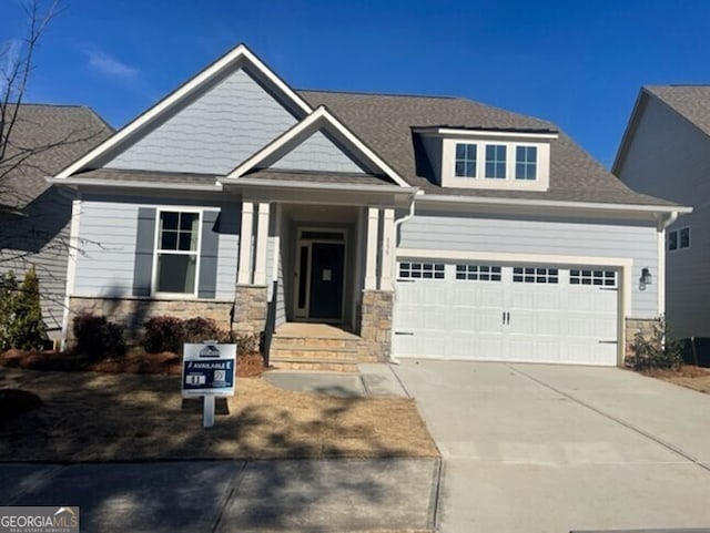 craftsman house with a garage