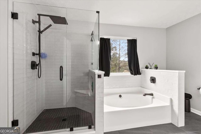 bathroom featuring shower with separate bathtub and tile patterned floors