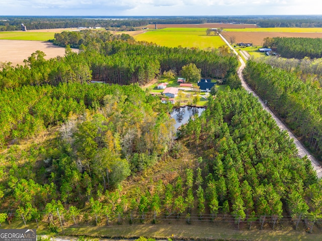 birds eye view of property with a rural view