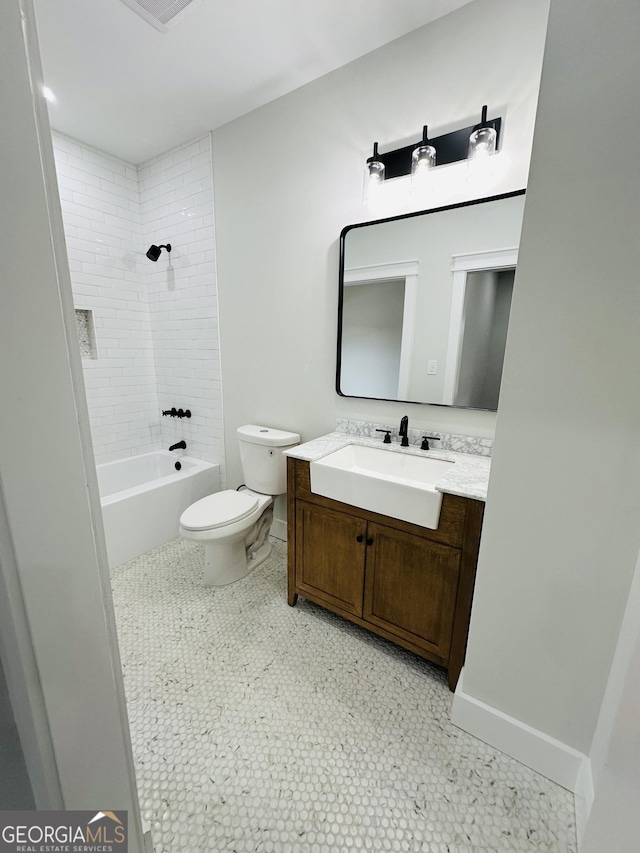 bathroom with toilet, shower / tub combination, baseboards, and vanity