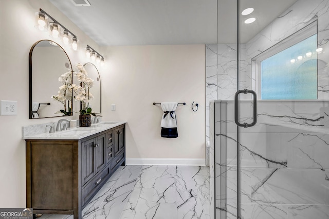 bathroom with vanity and a shower with shower door