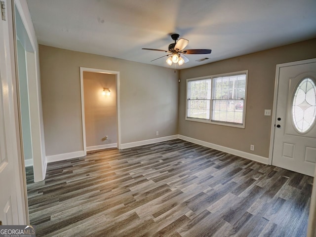 entryway featuring dark wood-type flooring and ceiling fan