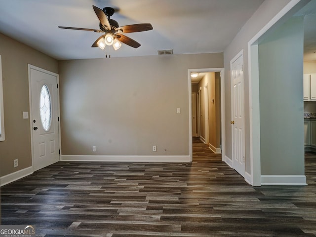 entryway featuring dark wood-type flooring and ceiling fan