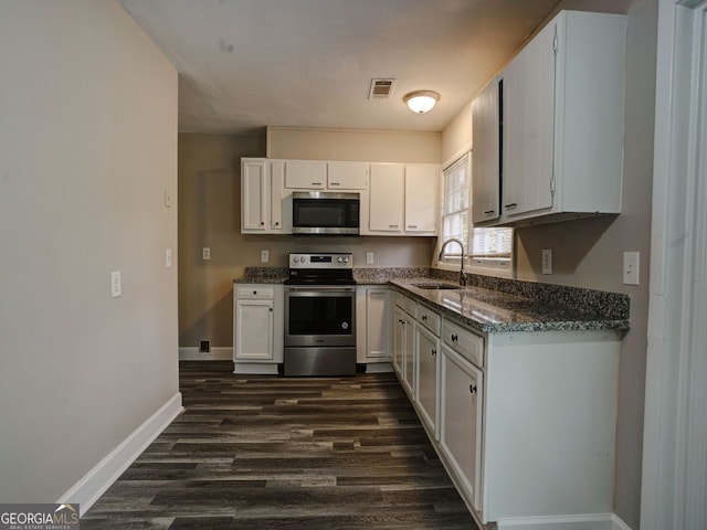 kitchen with stainless steel appliances, dark hardwood / wood-style floors, white cabinetry, and sink