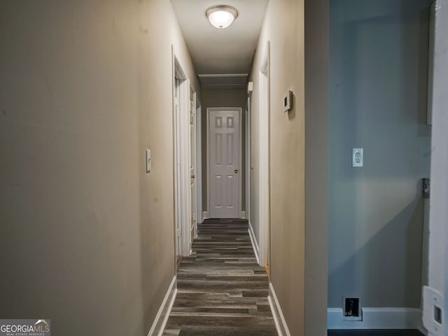 hall with dark hardwood / wood-style flooring