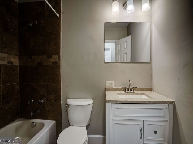 full bathroom with vanity, toilet, and tiled shower / bath combo