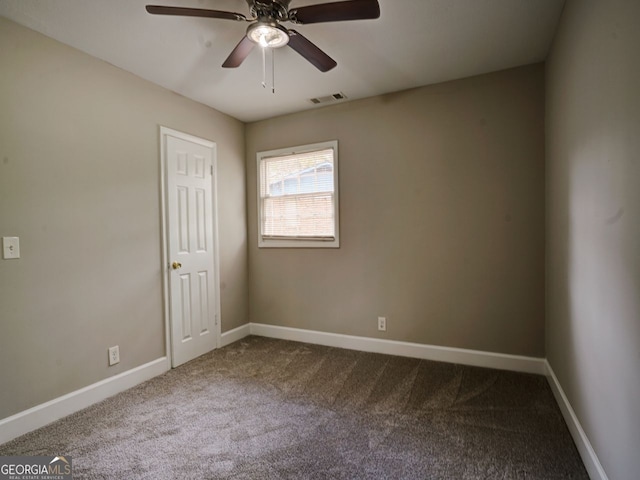 empty room featuring ceiling fan and carpet flooring