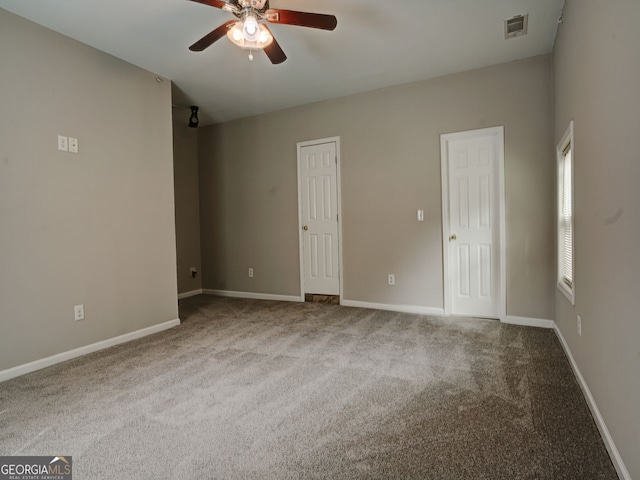 empty room with light carpet and ceiling fan