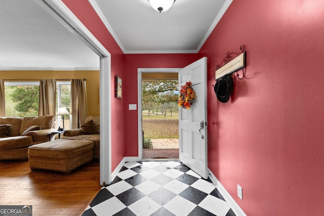 entrance foyer featuring hardwood / wood-style flooring and ornamental molding