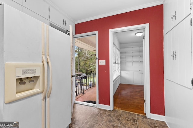 hallway featuring dark wood-type flooring and ornamental molding