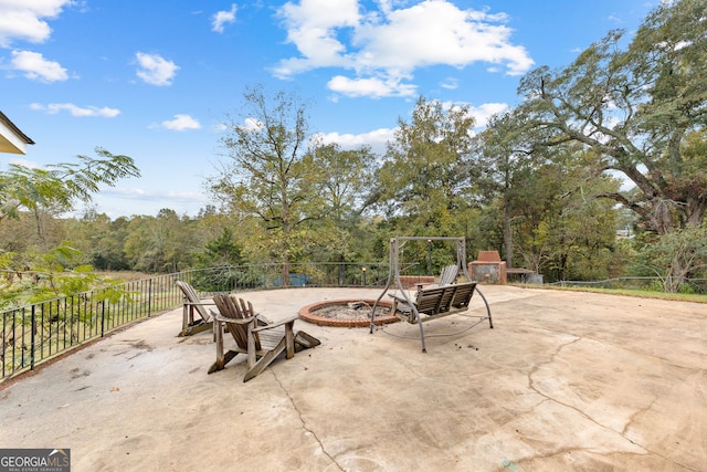 view of patio / terrace featuring an outdoor fire pit