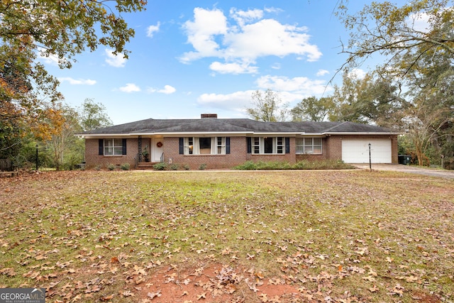 ranch-style house with a front lawn and a garage