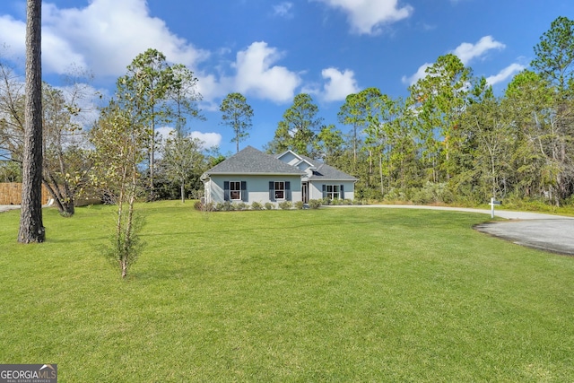 view of front of home with a front lawn