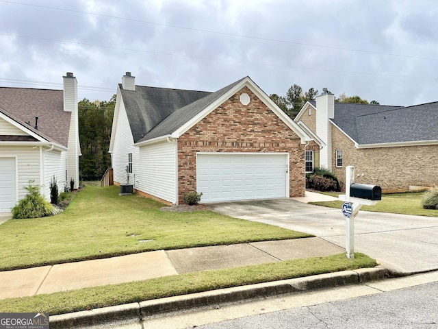 view of front of home with a garage and a front yard