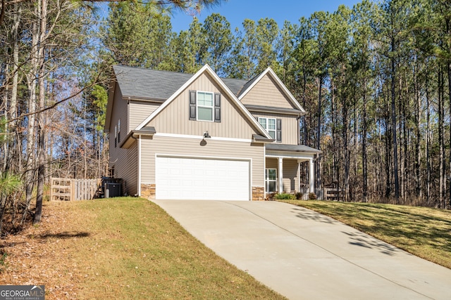 view of front facade featuring central air condition unit, a front lawn, a porch, and a garage