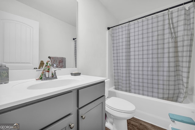 full bathroom featuring shower / tub combo, wood-type flooring, toilet, and vanity