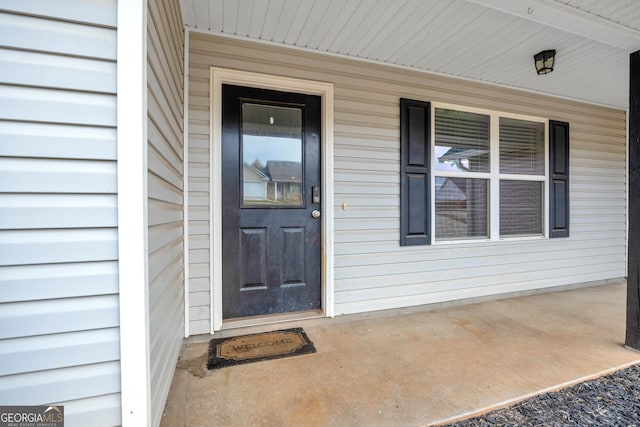 doorway to property featuring a porch