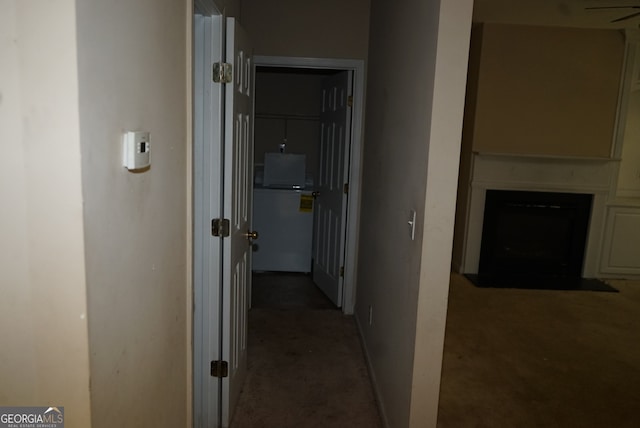 hallway with carpet floors