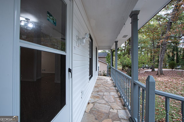 view of patio featuring a porch