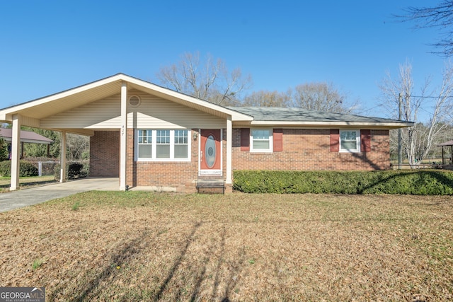 ranch-style home with a front lawn and a carport