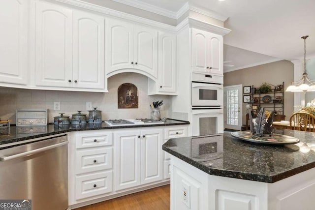 kitchen with white cabinetry, white appliances, crown molding, and a chandelier