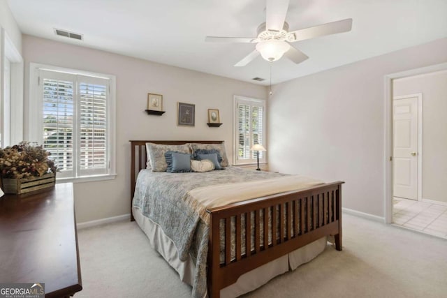 bedroom with visible vents, ceiling fan, baseboards, and carpet