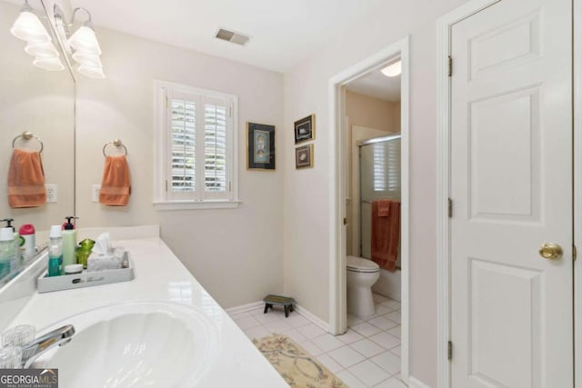 full bathroom featuring visible vents, an enclosed shower, toilet, a sink, and tile patterned flooring