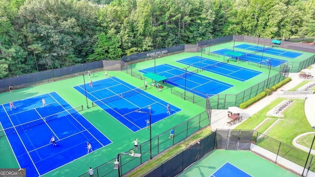 view of sport court with fence