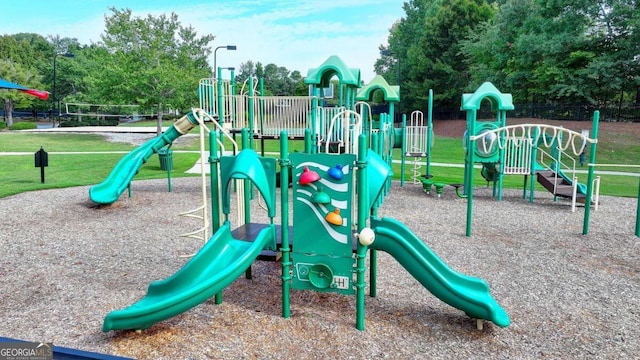 community play area featuring a lawn