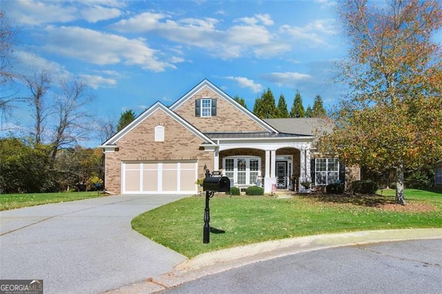 view of front facade featuring a garage and a front yard