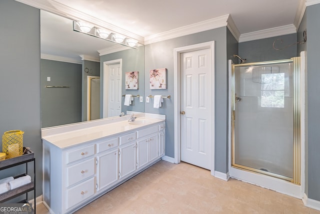 bathroom with ornamental molding, an enclosed shower, and vanity