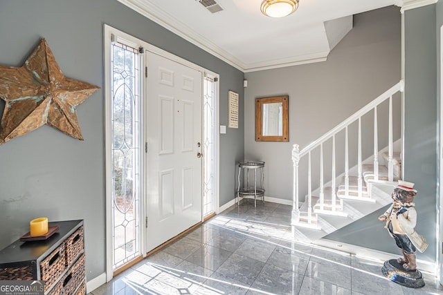 foyer featuring crown molding