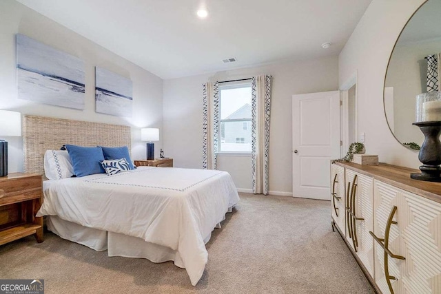 bedroom featuring light colored carpet