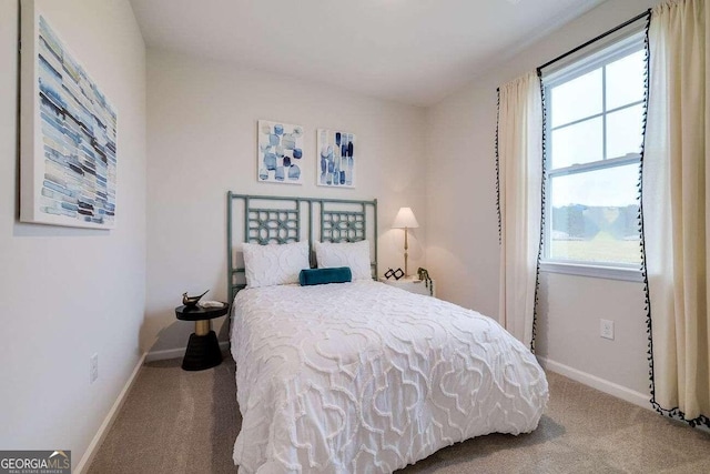 carpeted bedroom featuring multiple windows