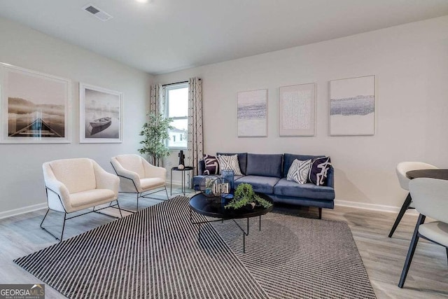 living room with light hardwood / wood-style floors