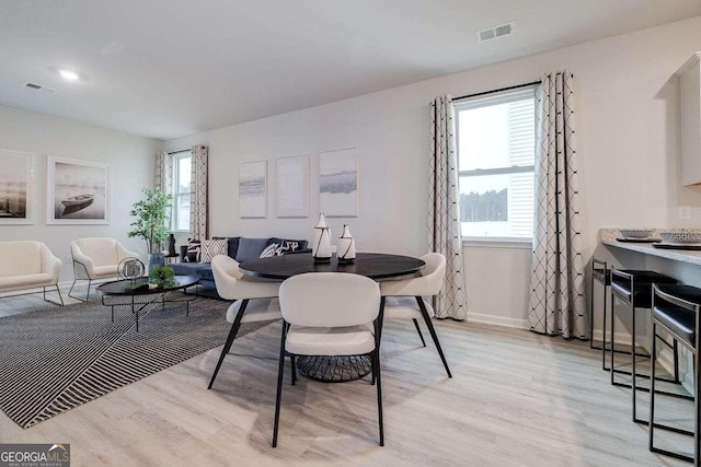 dining area with light wood-type flooring