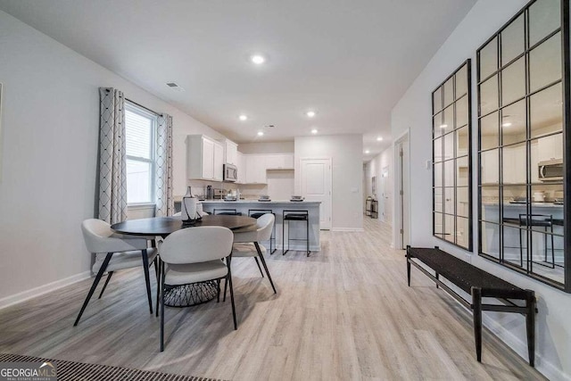 dining area featuring light hardwood / wood-style flooring