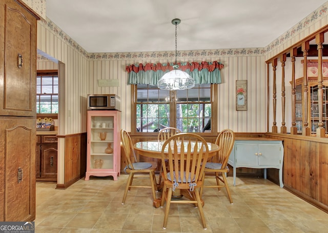 dining room with a chandelier and a healthy amount of sunlight