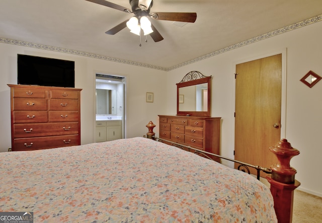 bedroom with carpet, ceiling fan, and ensuite bath