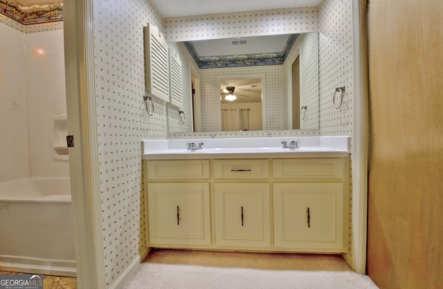 bathroom featuring ceiling fan and vanity