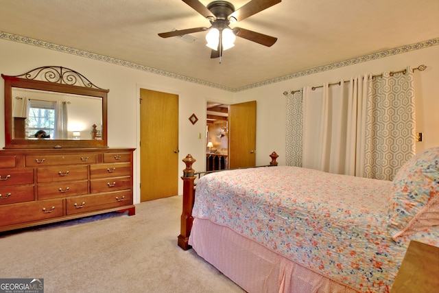 bedroom with light colored carpet and ceiling fan