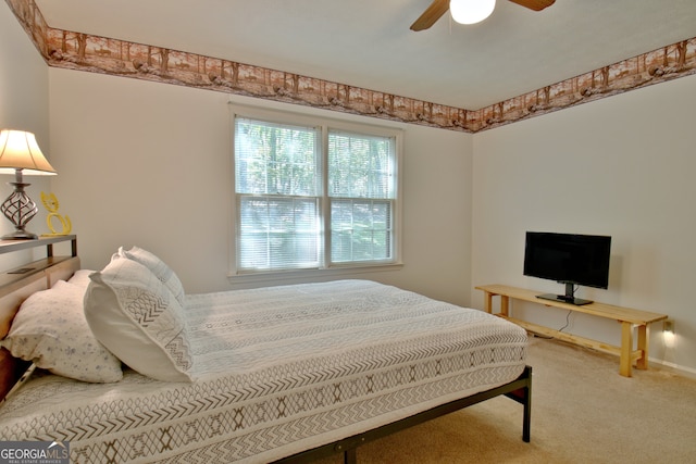 bedroom with ceiling fan and carpet