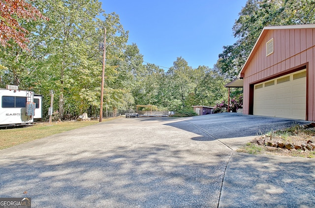 exterior space with a garage and an outdoor structure