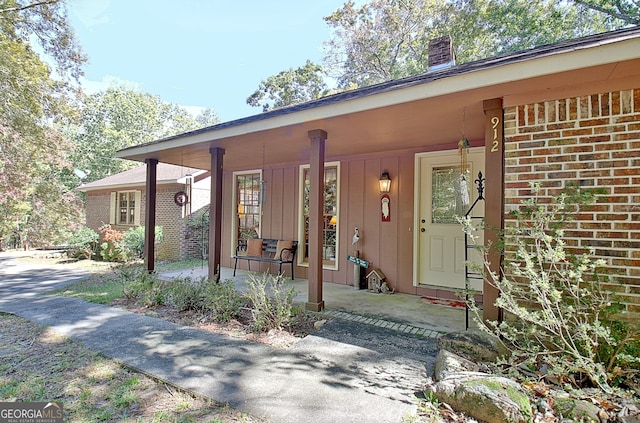 entrance to property with covered porch